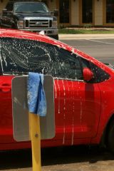 College girls washing a car