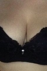 Huge boobs in a black bra.