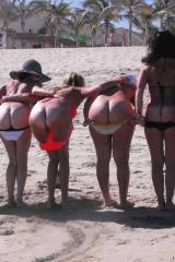 Seven mooning girls on the beach