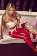 Loredana Chivu in skintight shiny red leggings