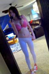 Pink bra and white yoga pants