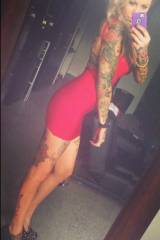 Inked in a tight red dress