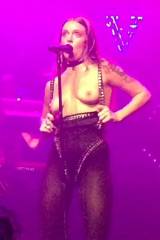 Tove Lo flashing during a live stage performance