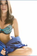 Sexy brunette wearing a blue/black bra and taking ...