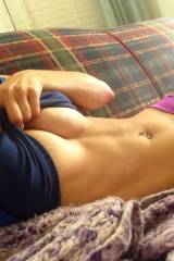Lying on the couch, half flashing