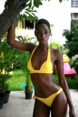 Elegant ebony model in yellow bikini