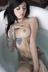 Wearing nothing but her tattoos and a choker. [x-p...