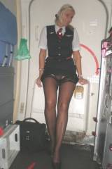 Lufthansa Stewardess pulling up her dress