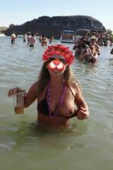 Flashing one boob in the lake