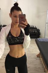 Bella Hadid - selfie in yoga pants and a sparkly s...