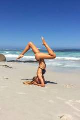 Impressive legs and yoga at the beach
