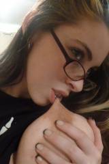 Nerdy Girl Sucking On Her Own Tits