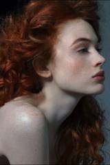 Porcelain skin; red hair
