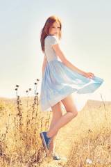 Redhead in blue in converse tennis shoes