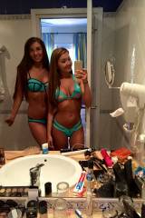 Two sexy girls in turquoise bikinis