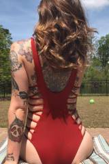 Red bathing suit and tattoos