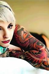 Blonde with short hair and ink sleeves; nice wallp...