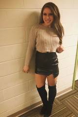 College cutie in leather skirt